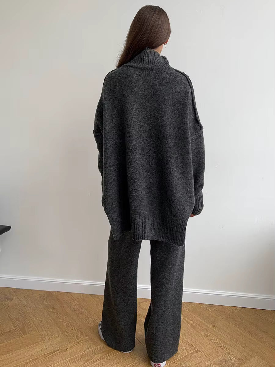 Vista de espalda del conjunto Alina en Marrón Gris oscuro: jersey oversize y pantalón de pierna ancha